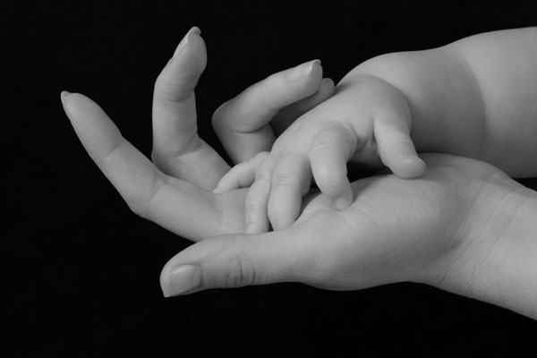 As a Mother Comforts Her Child…